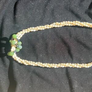 Pearl Necklace with some enhancements. Small light weight twisted pearl necklace